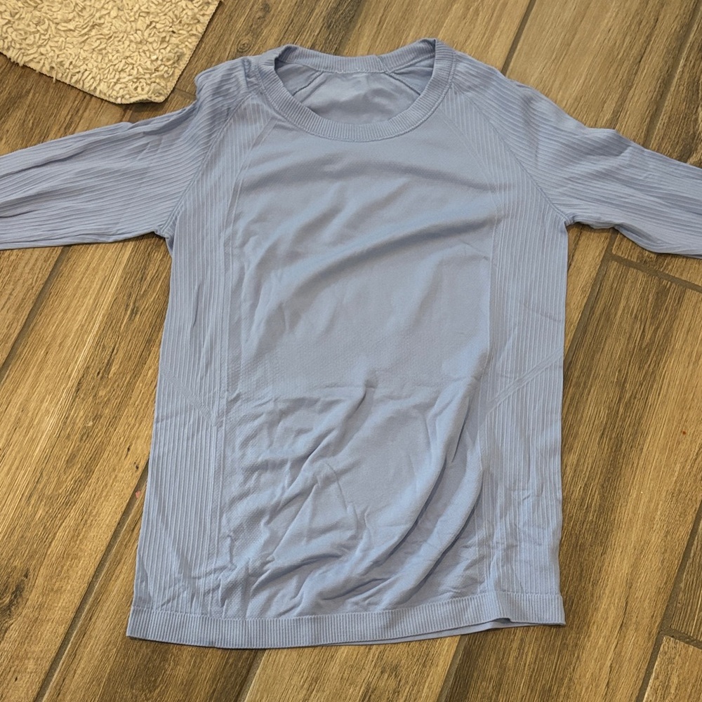 light blue athletic top